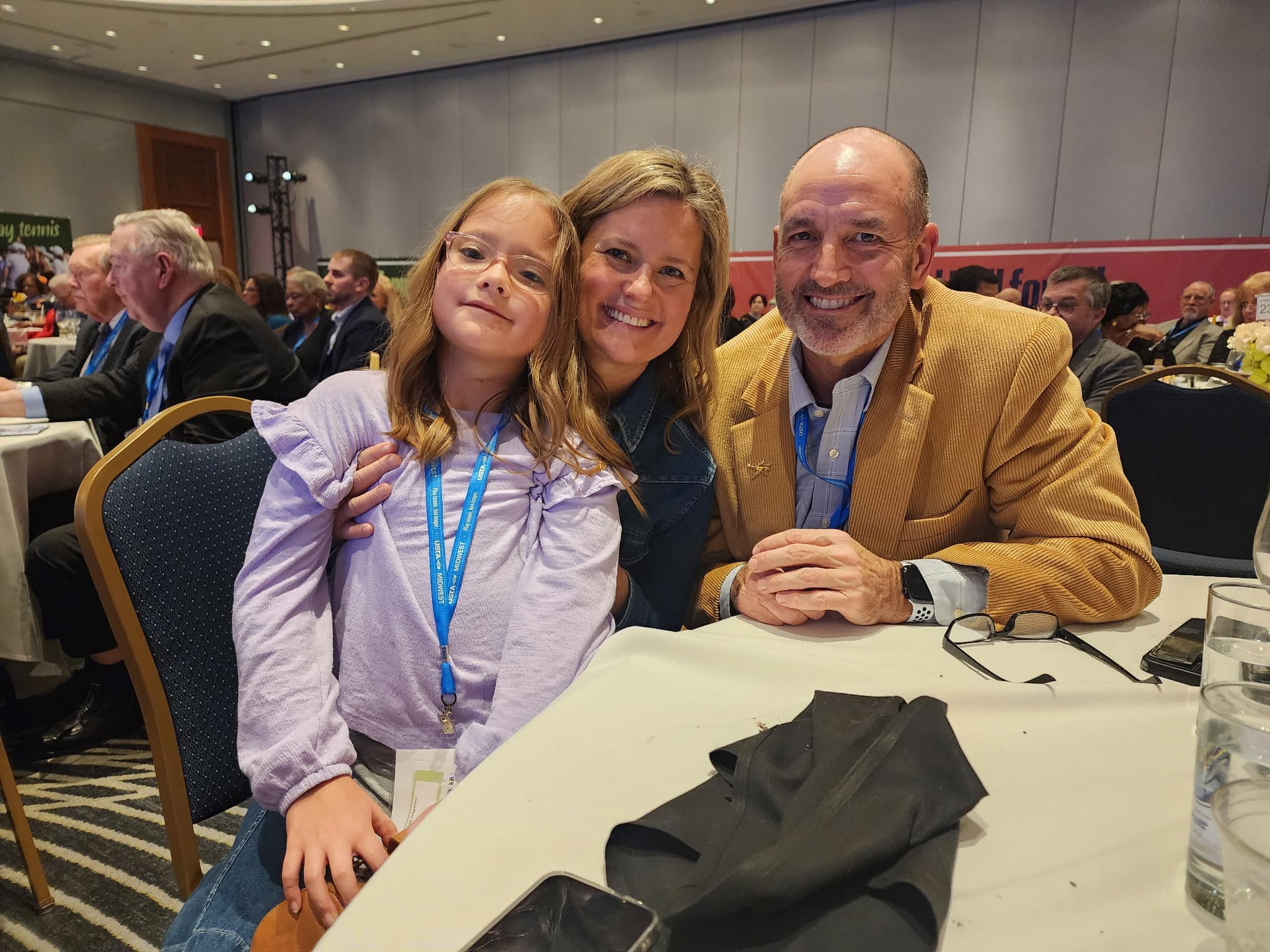 Rose O'Laughlin, her mother Jenny O'Laughlin, and Brian Dean at the 2024 Hall of Fame Induction Ceremony
